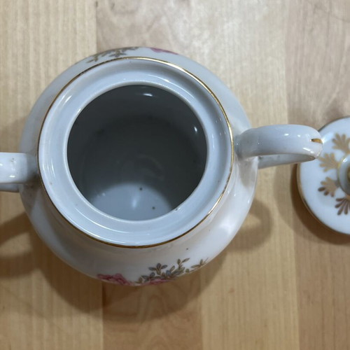 Porcelain tea set used with floral pattern, teapot, creamer, sugar bowl