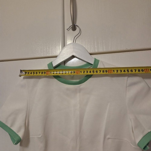 White blouse with green details, like new