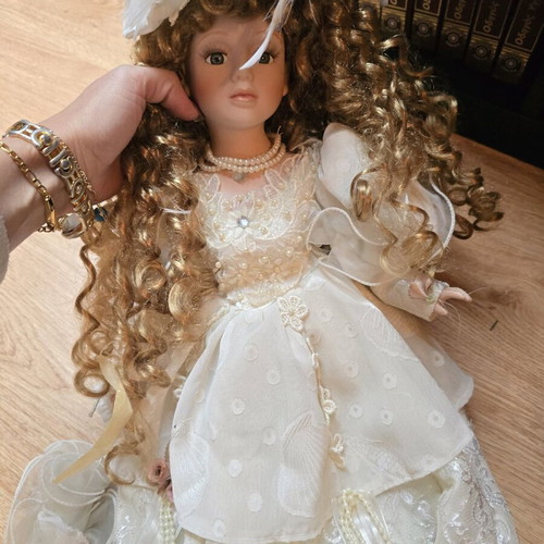 Glass Bride Doll like new with lace dress and hat