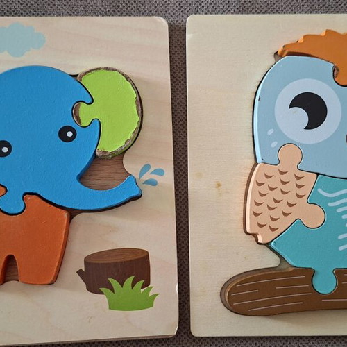 Wooden puzzles for children used, owl and elephant