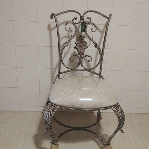 Set of 2 wrought iron dining chairs with decorative leaf details