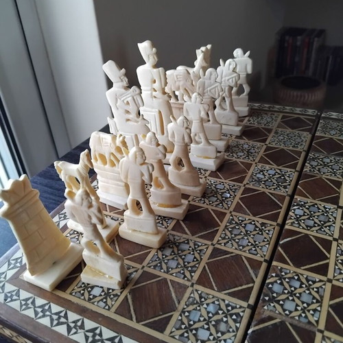 Handmade chess with mother-of-pearl and ancient Egyptian figures used