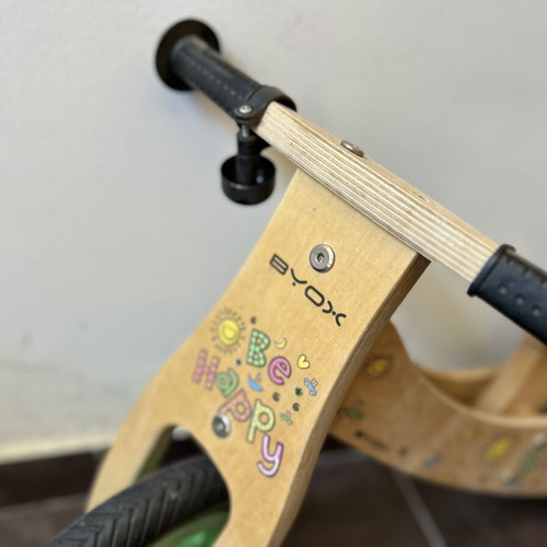Wooden children's balance bike with extra rear wheel