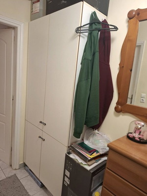 White melamine wardrobe used with three shelves