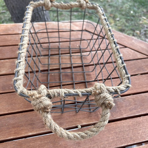 Boho style decorative basket with natural rope handles