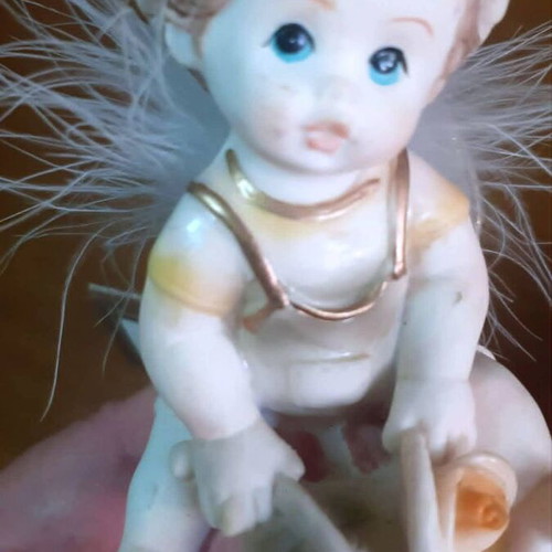Vintage porcelain figurine Trimar baby angel on snail, like new
