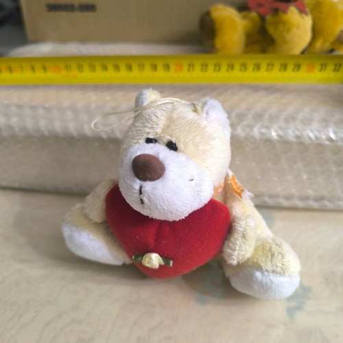 Small teddy bear with heart like new