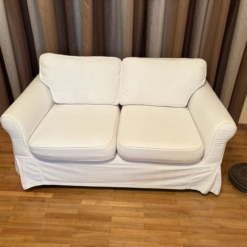 Two-seater sofa with white fabric cover like new