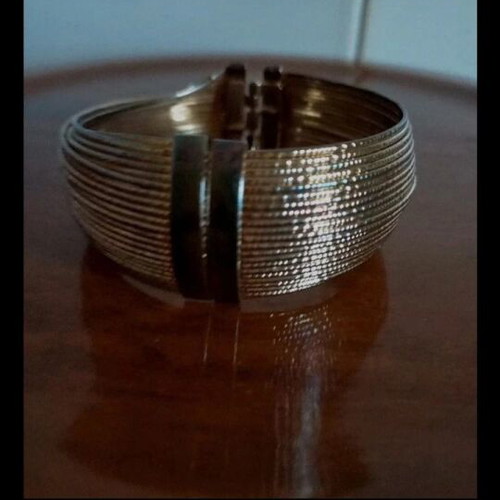 Faux Bijou gold bracelet like new with fixed bone style