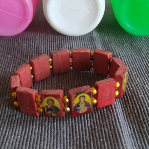 Bracelet with saints and holy water bottles pack used
