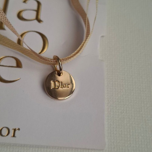 Dior bracelet with charm and adjustable ribbon new, gold and beige