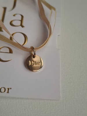 Dior bracelet with charm and adjustable ribbon new, gold and beige