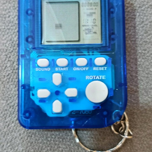 Game console keychain with many Tetris-style games new