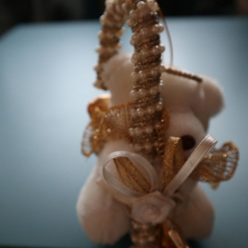 Christmas teddy bear like new with golden caramel and feathers