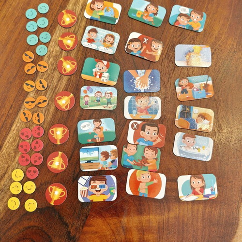 Magnetic reward chart used with 57-piece educational set