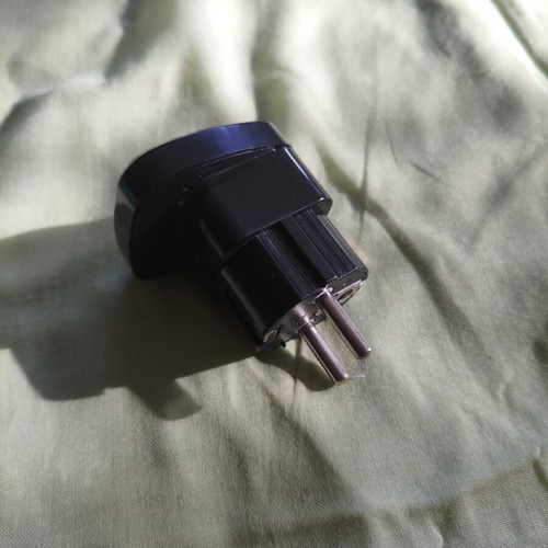 Universal travel adapter with safety cover, black