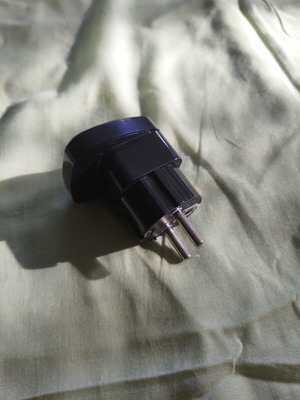 Universal travel adapter with safety cover, black