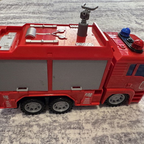 Fire truck toy used with sound, light, and water pump