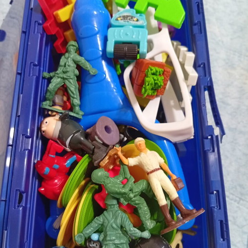 Toy pack with action figures, army men, and construction blocks like new