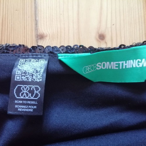 Something New women's black sequin skirt with fringes, XS-S