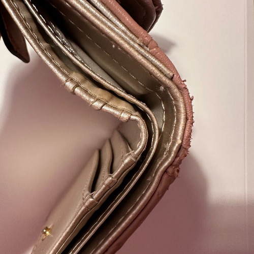 Guess wallet used, small size, pink with many compartments
