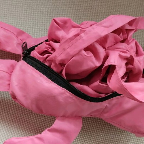 Fuchsia shoulder bag used for shopping with teddy bear pouch