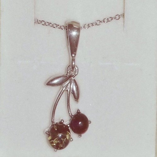 Silver cherry pendant new with brown and green amber