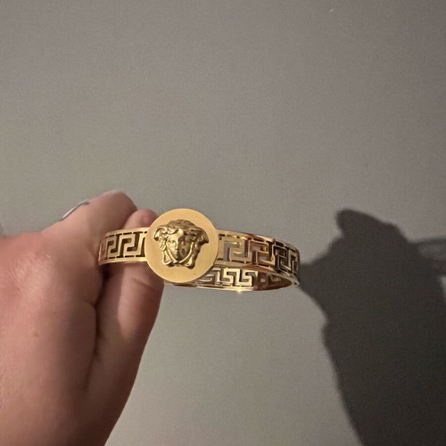 Versace gold hand bracelet like new