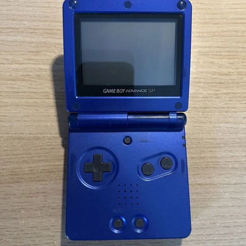 Game Boy Advance SP cobalt blue used with charger and NES Classics cartridge